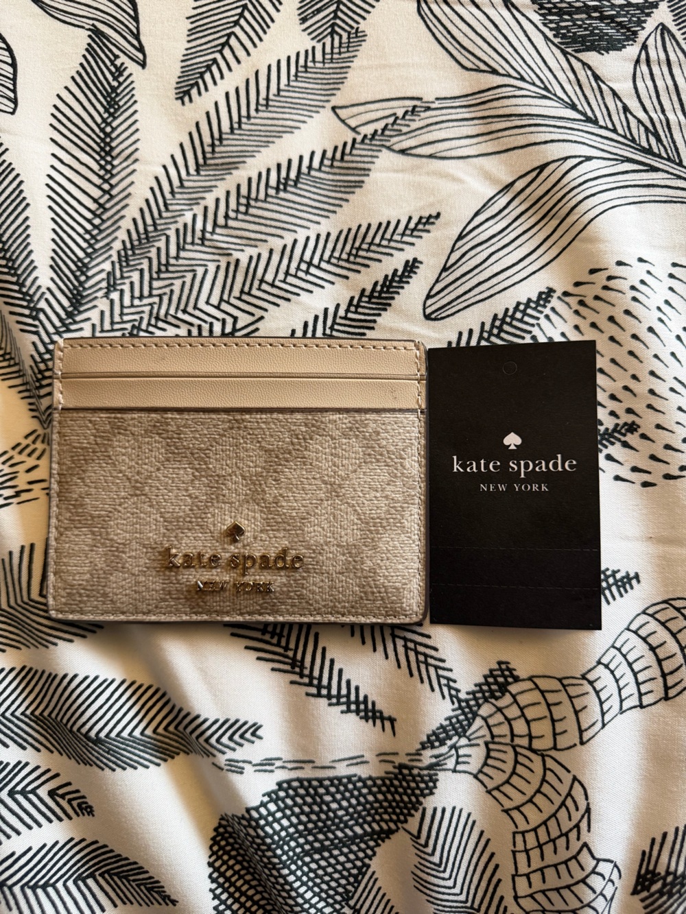 Kate Spade cream and gold card holder
